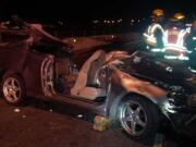 Four people were injured Friday night when a car crashed into a concrete barrier on Saint Johns Boulevard at the westbound onramp to state Highway 500.