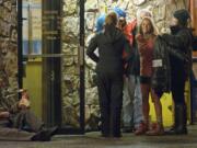 Oscar-winning actress Reese Witherspoon, second from right, takes a break outside Paul's Restaurant during filming of &quot;Wild&quot; in November 2013 in Vancouver.