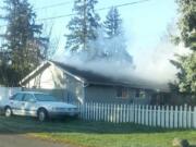 A fire in an attic of a house in Vancouver's Sunnyside neighborhood was put out within about 20 minutes by the Vancouver Fire Department.