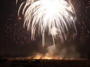 A field burns below the annual fireworks display Saturday at Fort Vancouver.