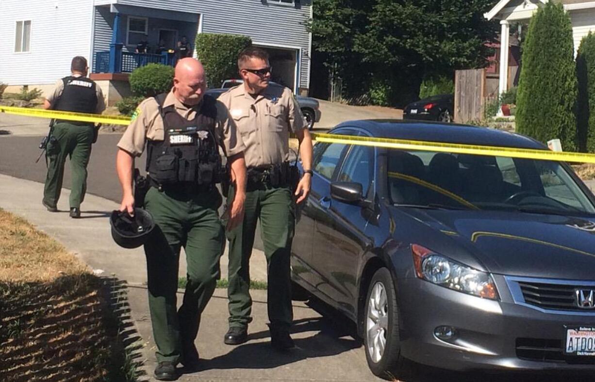 Clark County sheriff's deputies investigate at a home in Hazel Dell where three people have reportedly been shot and killed this afternoon.