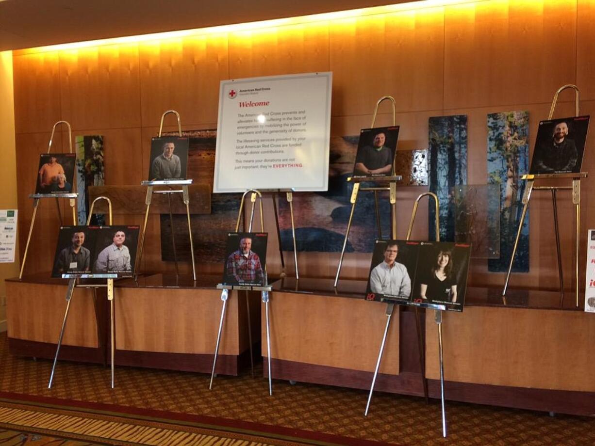 Portraits were displayed outside today's Real Heroes Breakfast at the Hilton Vancouver Washington, a fundraiser for the American Red Cross.