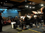 Rich Inouye, left, director of bands, applauds the College Clark College Jazz Ensemble during their performance at last year's Clark College Jazz Festival.