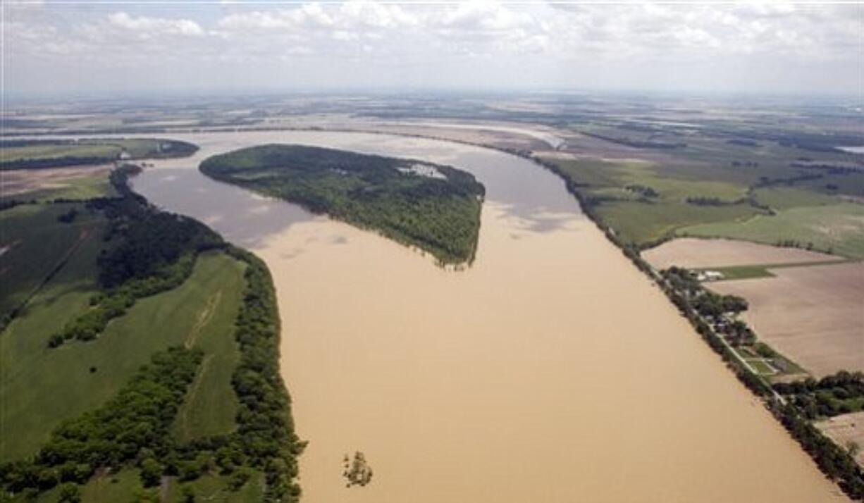 Flood waters from the Mississippi River encroach on to farm land near Tunica, Miss., Wednesday, May 11, 2011. Gov. Haley Barbour and other officials took an aerial trip along the Mississippi River and some of its tributaries to view the spreading damage from the flood waters. (AP Photo/Rogelio V.