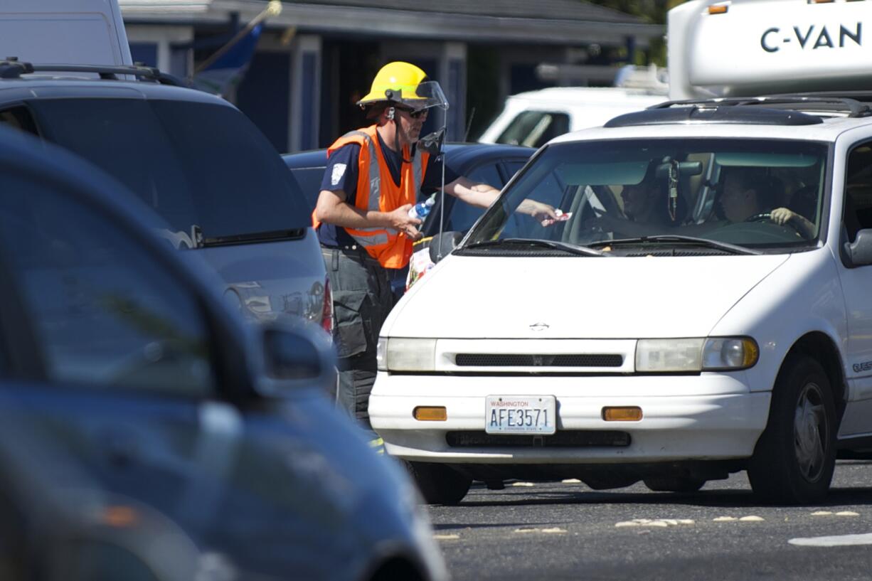 Vancouver: Vancouver Fire Department firefighter Kevin Hart takes donations Sept.