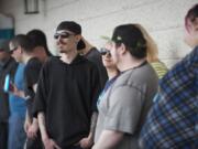 A crowd lines up for the grand opening of New Vansterdam marijuana shop on July 11.