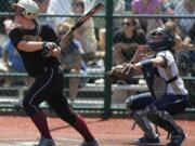 Taylor Ramey watches her game-winning, two-run home run sail over the fence as the Prairie softball team beat Kelso 8-7 in the 3A state tournament in Lacey (Jim Bryant/For The Columbian)