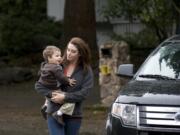 Sarah Remington drops off her son Jacob, 2, at Wendy's Teddy Bear Day Care in Vancouver in a Columbian file photo from October. Remington, a single mom, received a $3,000 bill in the mail from the state saying it paid her for child care subsidies for which she was ineligible. The state approved Remington in error, and now, she's responsible for the bill, which she can't afford.