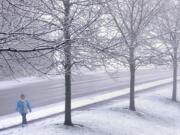 Peggy McCarthy, 72, finishes a 5-mile walk along Northwest Bliss road Thursday in Vancouver, Washington. &quot;It would be nice to have a little more snow,&quot; said McCarthy.