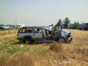 Washington State Patrol troopers investigate a single-car crash in the median of Interstate 5 near the Ridgefield Port of Entry.