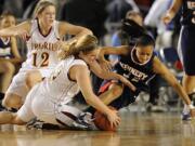 Angela Gelhar, 10, of Prairie High School steals the ball away from Jasmine Lemon, 12, of Kennedy Catholic during the second half Thursday March 3, 2011 at the WIAA girls 3A State Basketball Championships at the Tacoma Dome in Tacoma, Washington. Gelhar scored 16 points and had 2 steals in the game. The Falcons beat the Lancers 46-40.