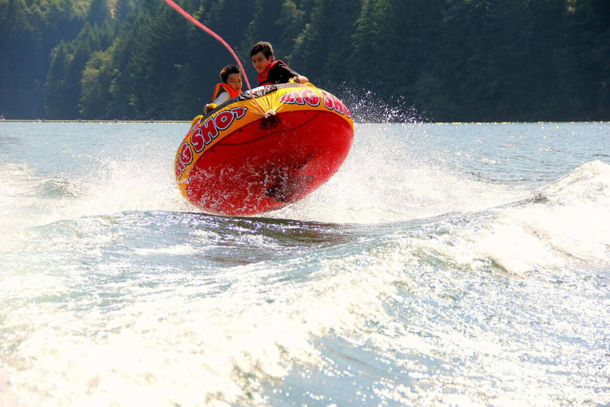 Cousin and Friend enjoying themselves on the inner tube.