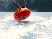 Cousin and Friend enjoying themselves on the inner tube.