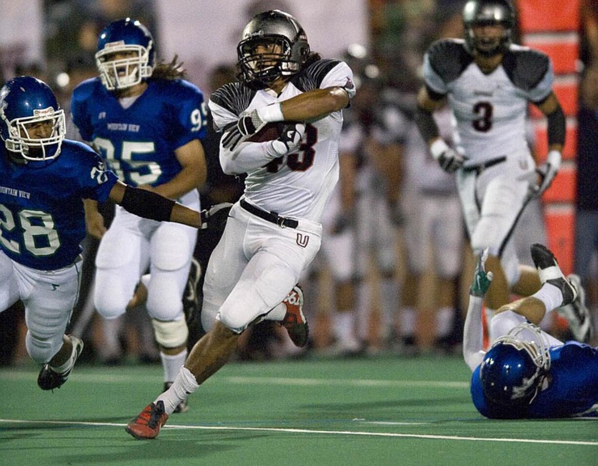 Union's Brandon Brody-Heim carries the ball against Mountain View in the first half at McKenzie Stadium on Friday October 1, 2010.