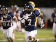 Skyview's Ellis Henderson takes a screen pass for a touchdown against Columbia River on Friday at Kiggins Bowl.