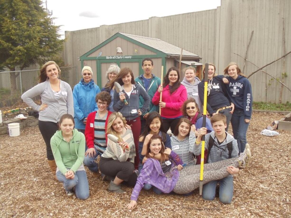 Day of Caring: Vancouver School of Arts and Academics students assist WSU Master Gardeners and Growing Groceries Mentors, Bobbi Bellomy, Marcia Grubb, and Barbara Nordstrom at the Hazel Dell School and Community Garden.