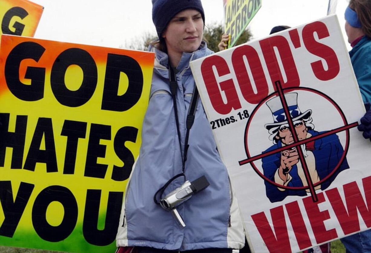 Katherine Hockenbarger is one of six protestors that stood outside the Temple Bible Church in Temple, Texas, Friday, March 17, 2006 during the funeral service for Pfc. Amy A. Duerksen. Duerksen, 19, died March 11 in Iraq, the Temple Daily Telegram reported. The protestors are affiliated with Westboro Baptist Church  in Topeka, Kansas. The Kansas protesters claim the deaths of soldiers in Iraq are divine punishment for America's toleration of homosexuals.