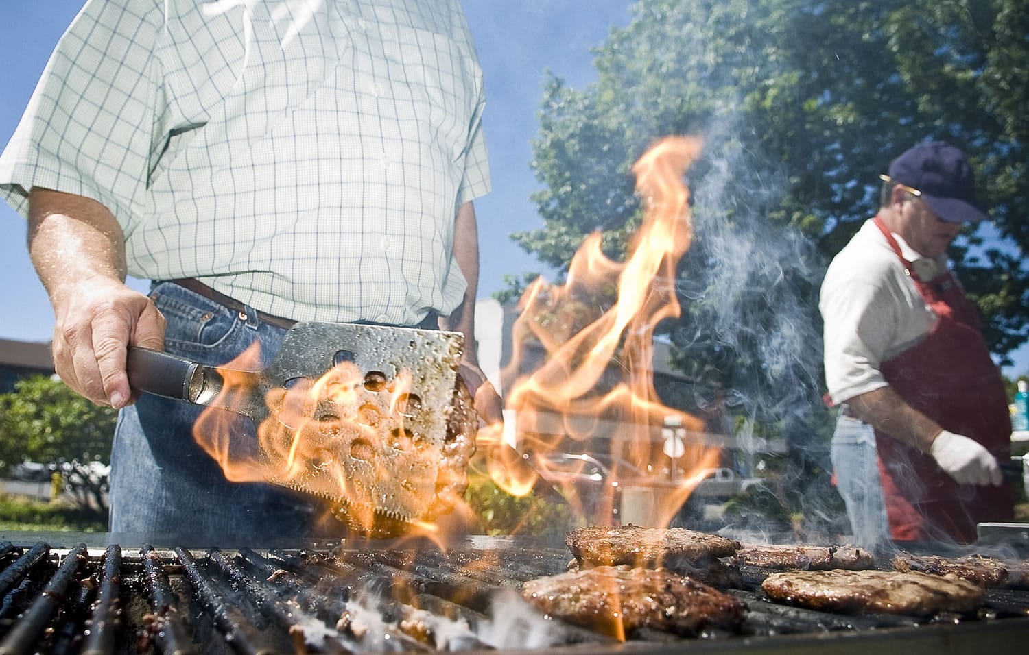 Alan Park with Realvest takes a break from construction managing to flipping burgers -- charred ones at that -- in August 2008.