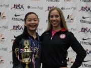 Malia Hee of Vancouver, left, received her gold medal from Olympic champion Mariel Zagunis after Friday's cadet women's sabre championship at the USA Fencing Junior Olympics.