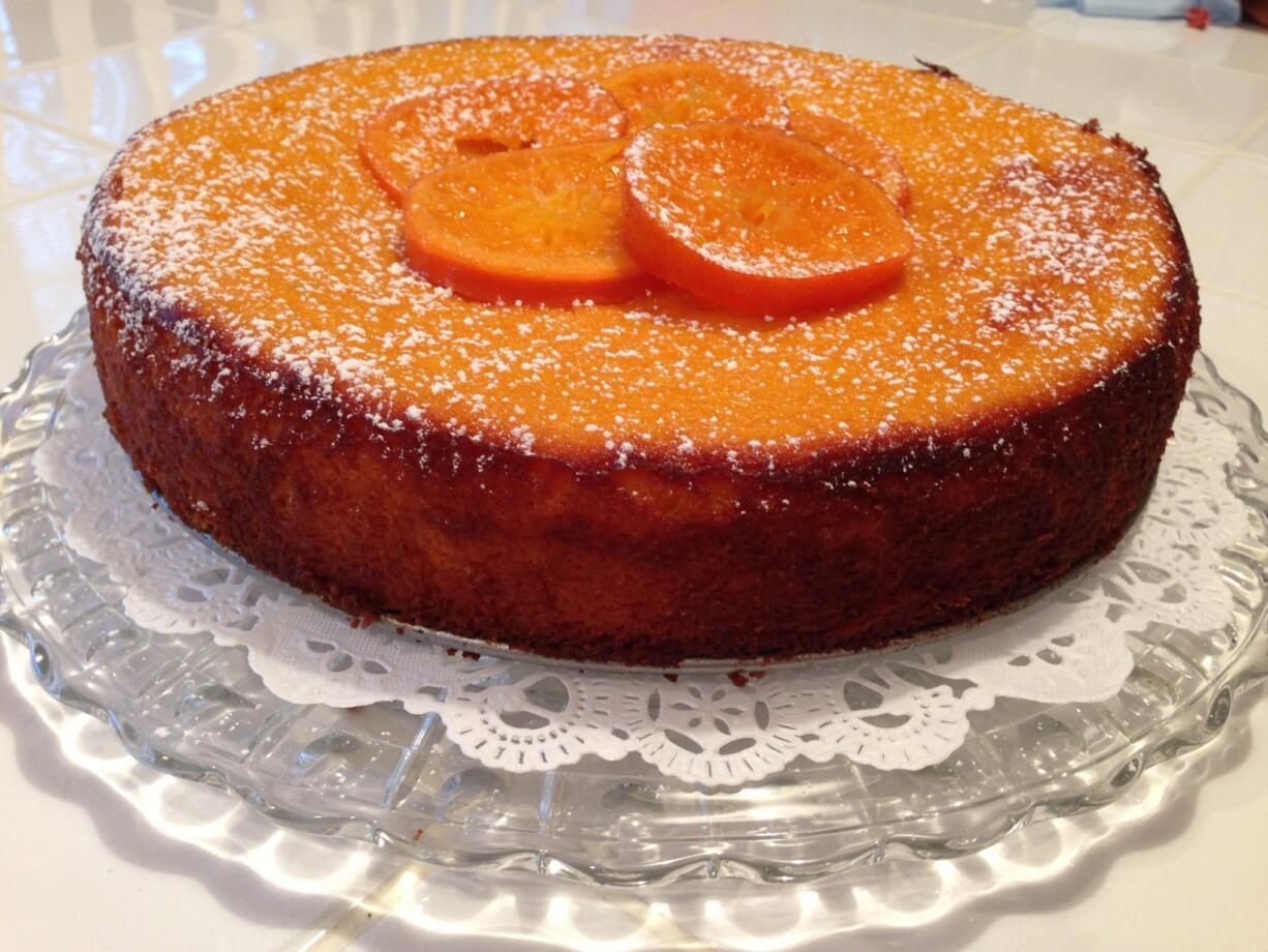 Clementine Cake topped with powered sugar.