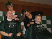 Pacific Crest Academy Middle School teacher Angela Dasso and sixth-grade student Jerrica Pachl shave their heads at the St. Baldrick's Foundation event on Jan.