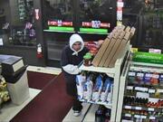 An image from video surveillance of a suspect who, police say, robbed a 7-Eleven Jan.