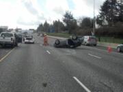 Three vehicles collided on Interstate 205 near Clackamas Friday morning after a dog got onto the freeway.