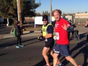 Kyle Robiduox (right) finished in third place in his division with the help of his guide Dan Streetman at the California International Marathon, in Sacramento. Robiduox is training for the Boston Marathon.