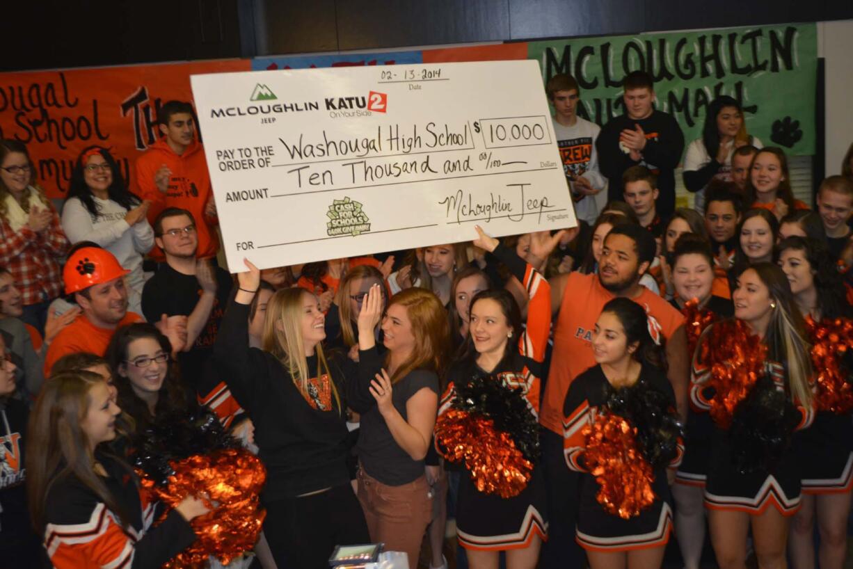 An enthusiastic group of WHS students accepted a $10,000 check in the Cash for Schools contest.