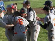 Panthers roughhouse on the diamond after Brandon Casteel brought home the winning run in a 6-5 victory against La Center in eight innings Thursday, at Washougal High School.