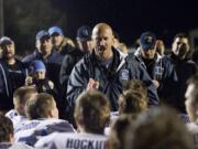 An emotional Hockinson head coach Rick Steele talks to his team after beating Woodland for the league title, Friday, Oct.