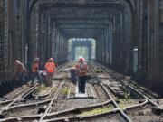 Workers for BNSF Railway are turning their attention to improving tracks, signals, and switches from Vancouver's Amtrak station to the aging Columbia River railroad bridge.