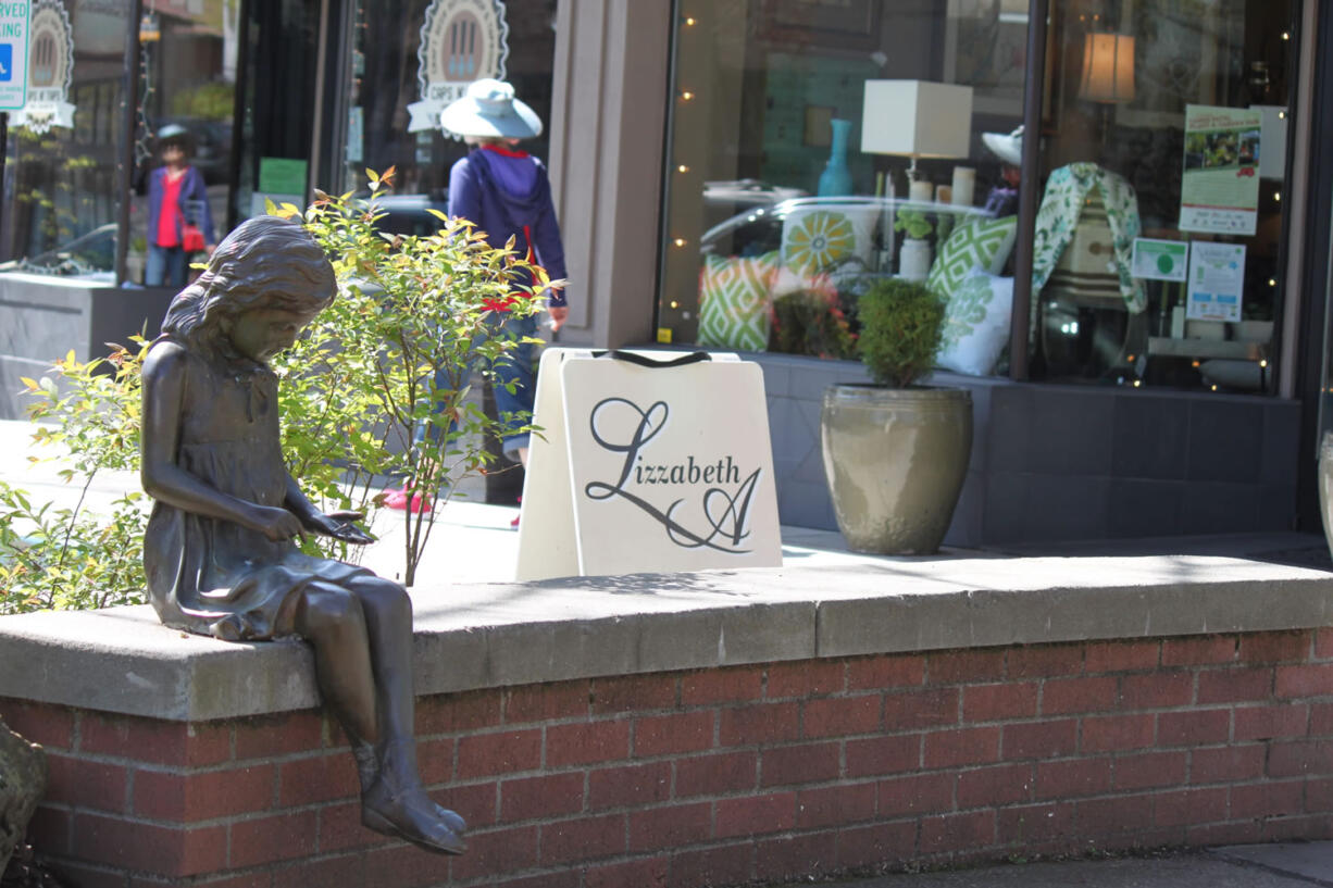 The bronze statue of a little girl will soon get its book back.