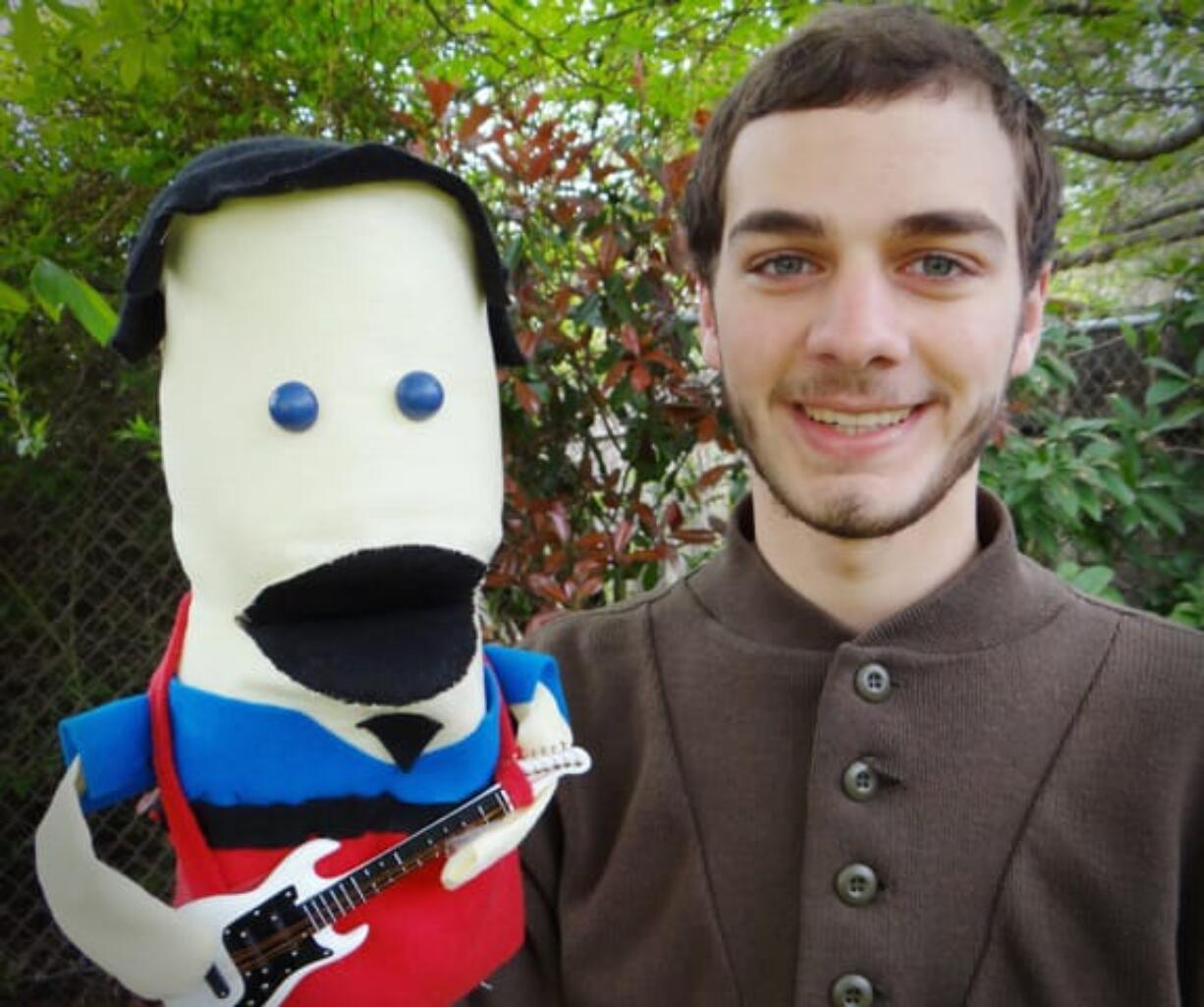 Vancouver School of Arts and Academics' Ryan Hanrahan, 17, shows a puppet likeness of Danny Weinkauf, the bass player for the band They Might Be Giants, who hired the teen to make a humorous sock puppet music video for the musician's upcoming kids album.