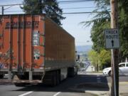 A truck travels westbound on West 39th Street, one of four east-west arterials from Interstate 5 to industrial areas.