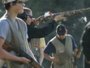 Woodland High School is the only local high school with a trap-shooting club. They practice at Rainier Rod and Gun Cub in Rainier, Oregon, Thursday, April 10, 2014.