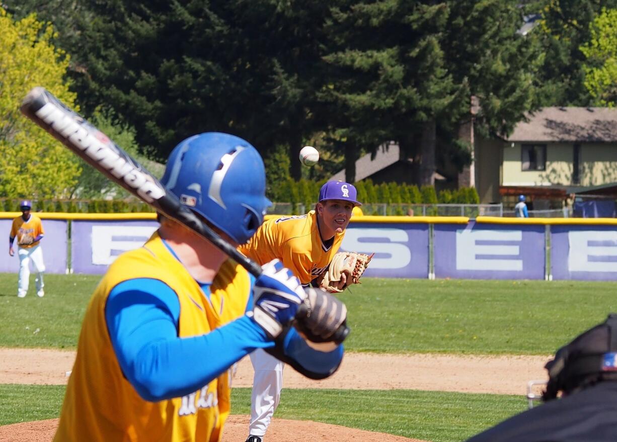 Columbia River's Jace McKinney delivers a pitch against Kelso on Saturday, April 18, 2015.