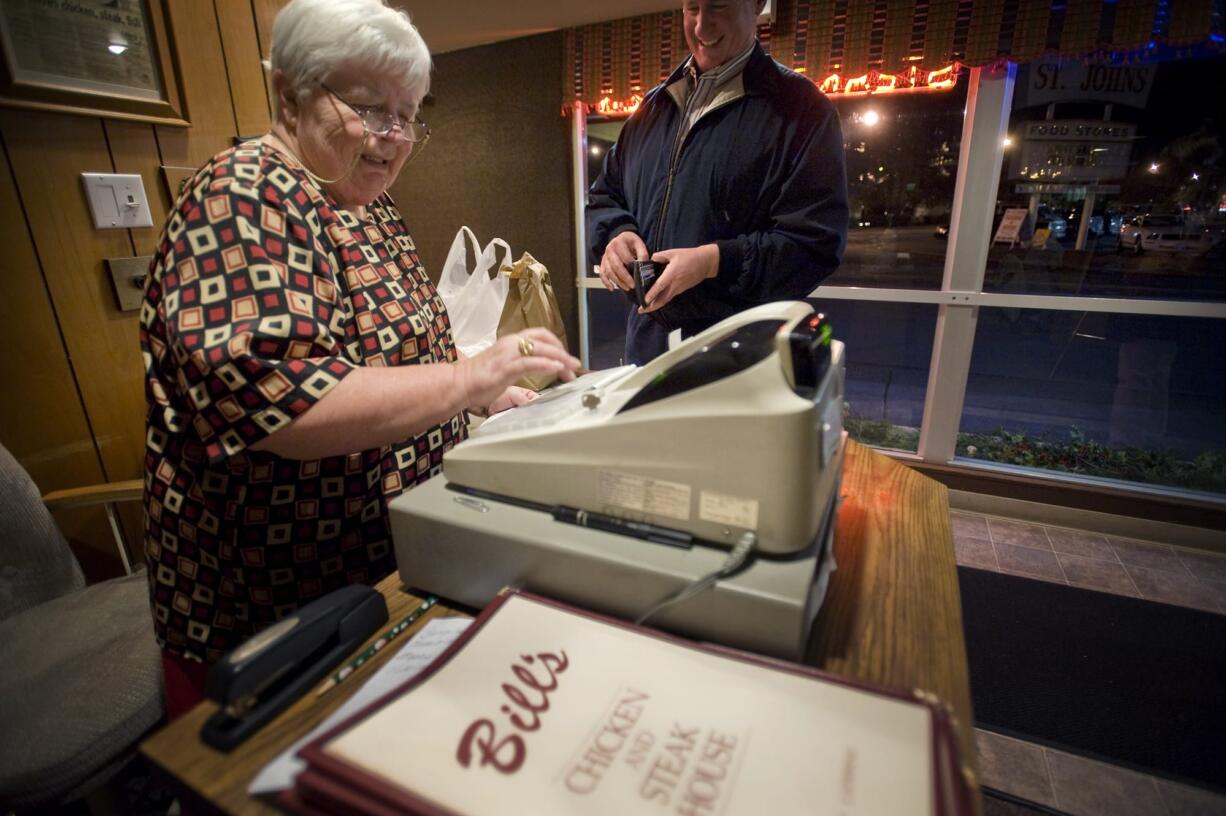 Proprietor Jane Wiger rings up a customer at Bill's Chicken and Steak House in 2010.