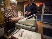 Proprietor Jane Wiger rings up a customer at Bill's Chicken and Steak House in 2010.