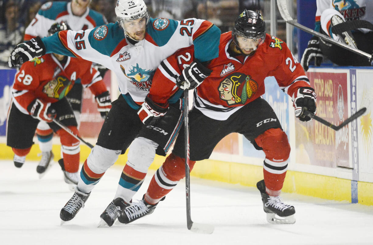 Portland's Mathew Dumba (24) and Kelowna's Colton Heffley (25) race down the ice while chasing the puck during WHL first period of Game 2 on Saturday.