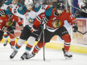 Portland's Mathew Dumba (24) and Kelowna's Colton Heffley (25) race down the ice while chasing the puck during WHL first period of Game 2 on Saturday.