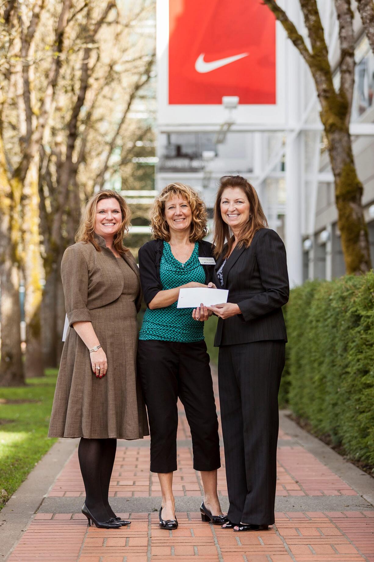 Hudson's Bay: Parks Foundation marketing associate Sherry Thompson, left, and executive director Cheri Martin with Kathy Webb of Nike.