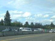 Police approach the occupants of a reportedly stolen vehicle on Interstate 5 southbound, near 99th Street.