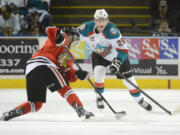 Kelowna Rockets, Cole Linaker tries to steel the puck away from Portland Winterhawks, Brendan Leipsic on a power play opportunity for the hawks during WHL first period game 5 play off action at Prospera Place on Friday evening.