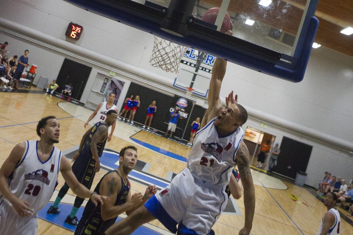 Kevin West dunks the ball at the Volcanoes last game of their season on Sunday, June 30, where they beat the Japan Nippon Tornadoes.