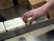 David Joles/Minneapolis Star Tribune
Production worker Shane Malherek boxes up one pound chunks of freshly churned butter April 10 at Hope Creamery in Hope, Minn.