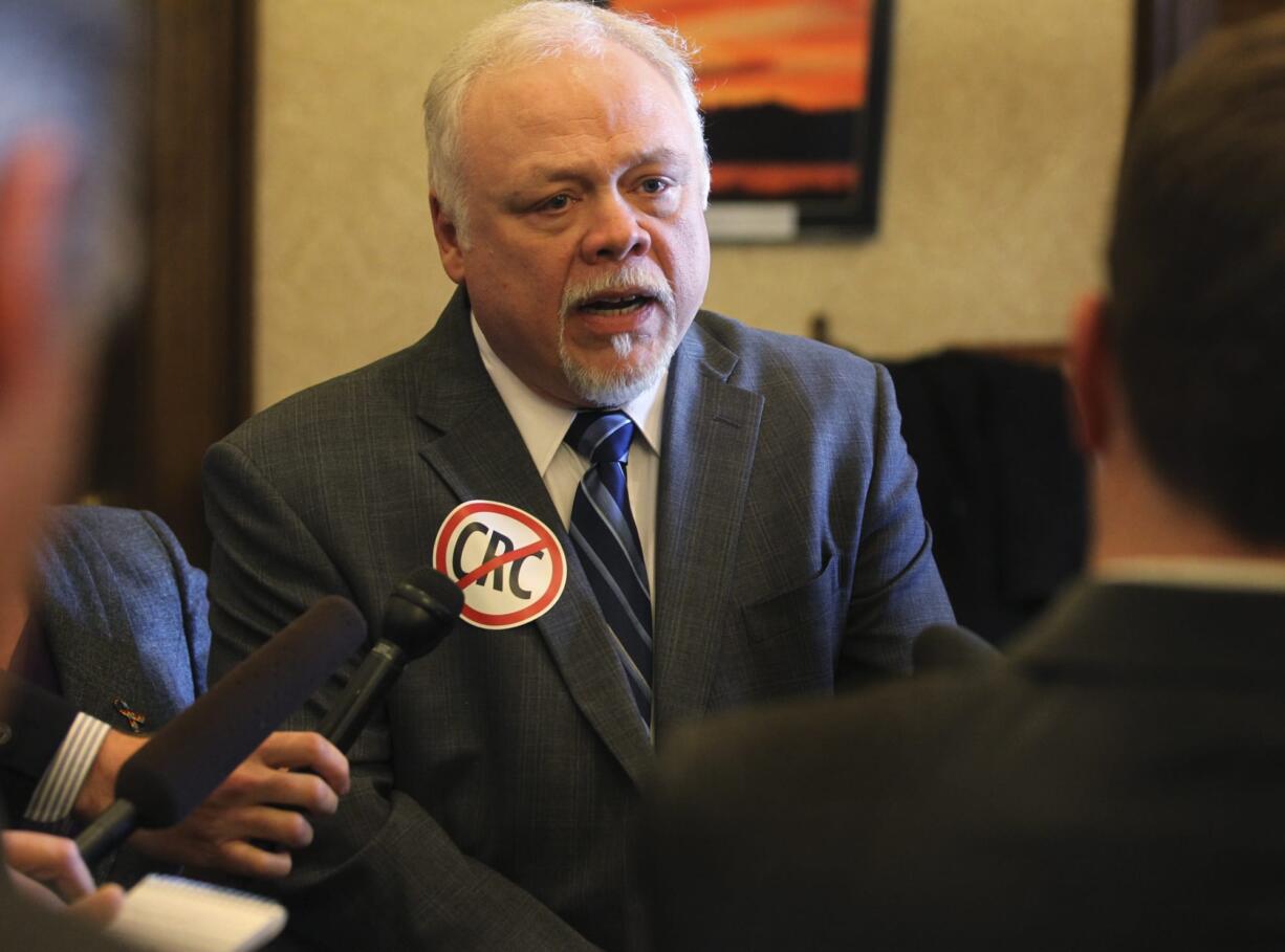 Sen. Don Benton, R-Vancouver, speaks with reporters April 10 in Olympia.