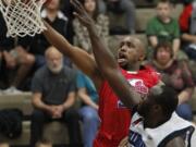 Vancouver Volcanoes guard Andre Murray, left, shoots against Bellingham in a game earlier this season.