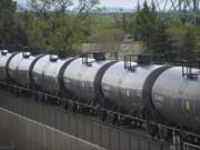 An oil train passes through downtown Vancouver on Friday.