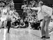 Lionel Hollins (14) relays instructions to teammates from coach Jack Ramsay during the Blazers' championship playoff run in 1977.